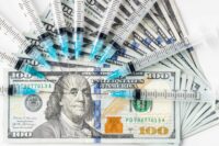 Scientists Debate Adult Booster Shots, $1 Billion Savings Examined